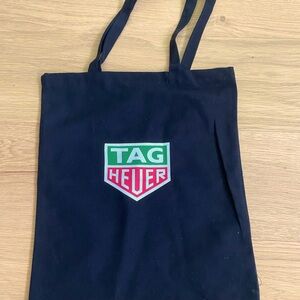TAG HEUER cloth bag black with stamped logo
14" across 16"long. Never used